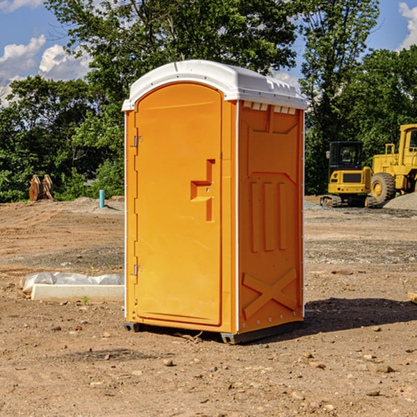 what is the cost difference between standard and deluxe portable restroom rentals in Covington County